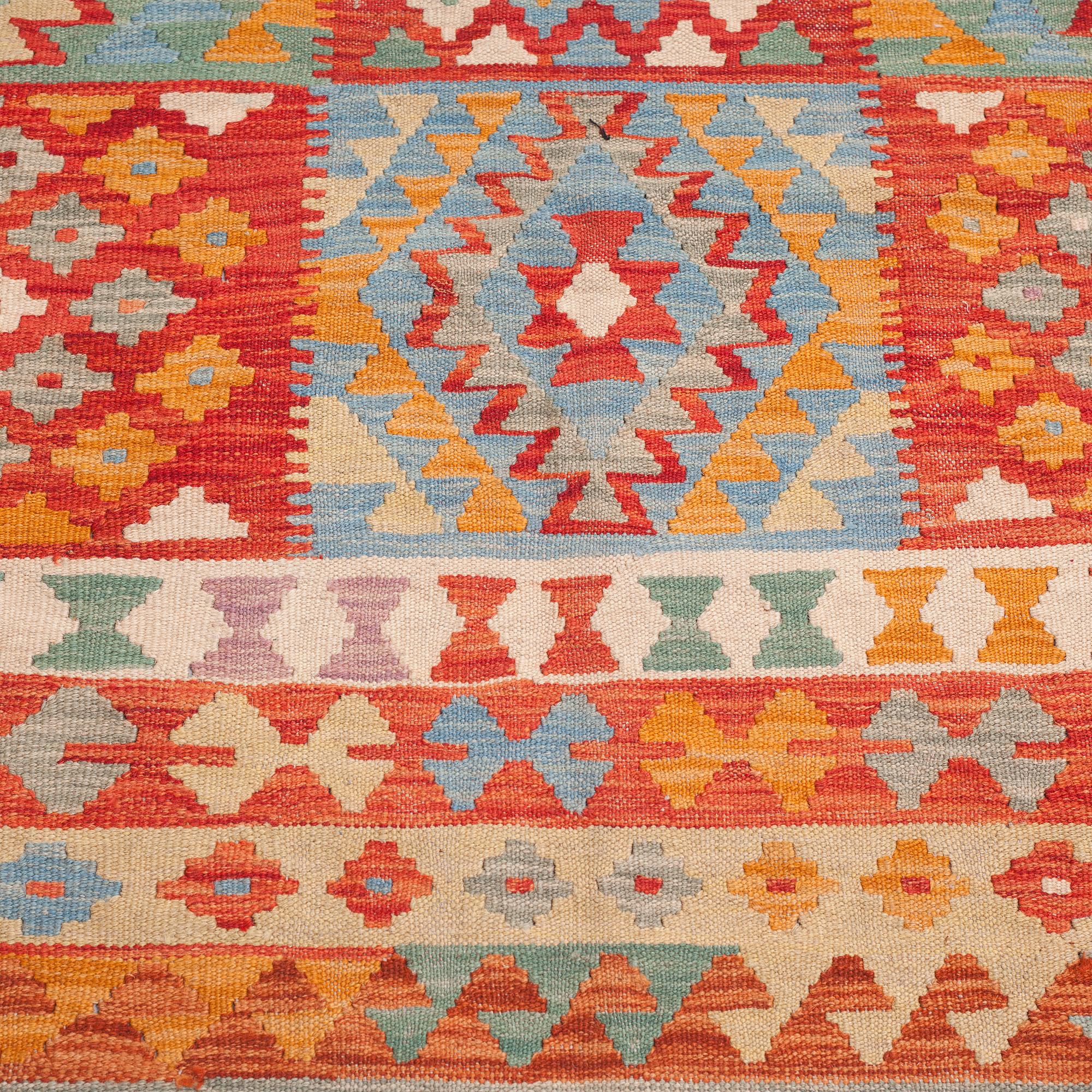 A kelim rug, 303 x 205 cm.