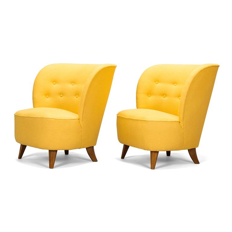 A pair of mid-20th-century armchairs.