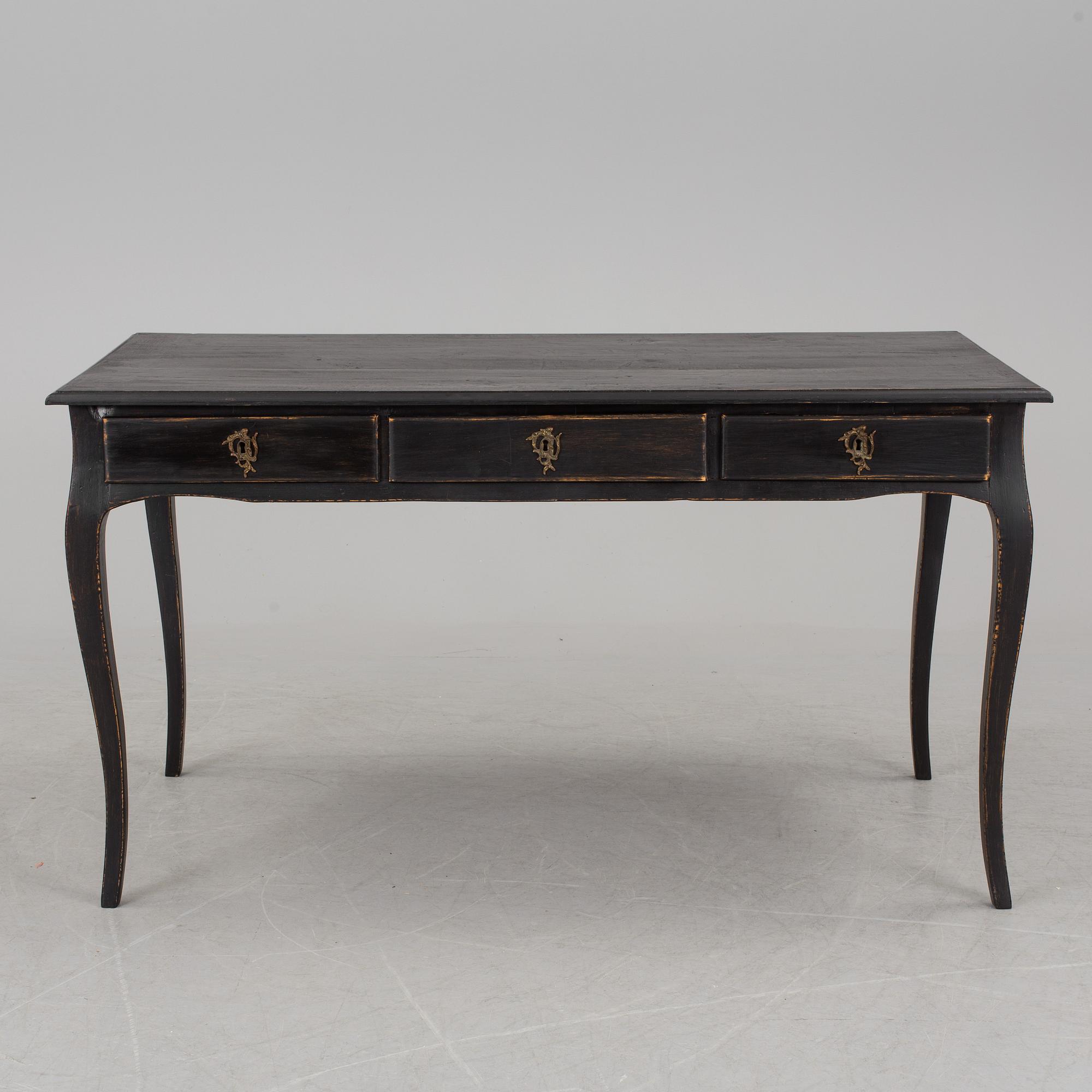 A partially rococo, 18th century writing desk.
