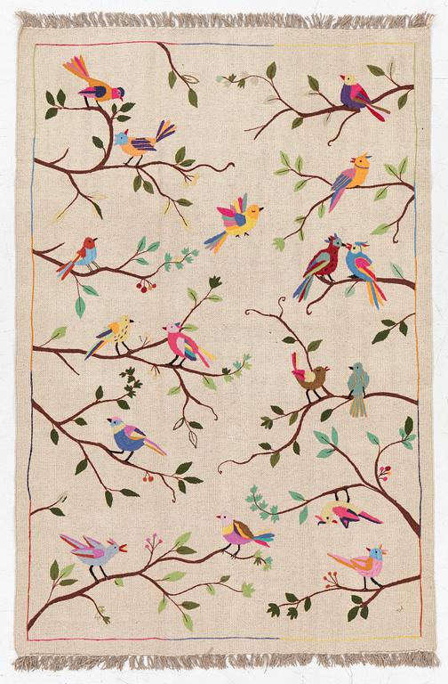 A hand-embroidered kelim rug, c. 183 x 125 cm.