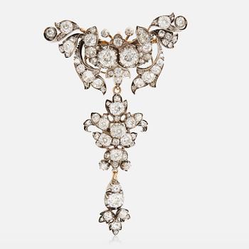 918. A 14K gold and silver brooch set with old-cut diamonds.