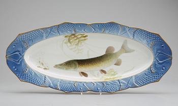 Twelve Danish Royal Copenhagen porcelain fish plates and a serving dish.