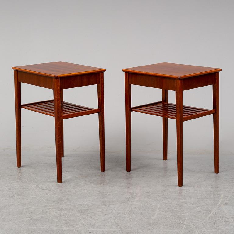 a pair of mahogany bedside tables.