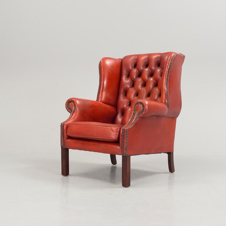 a 20h Century red lether armchair.