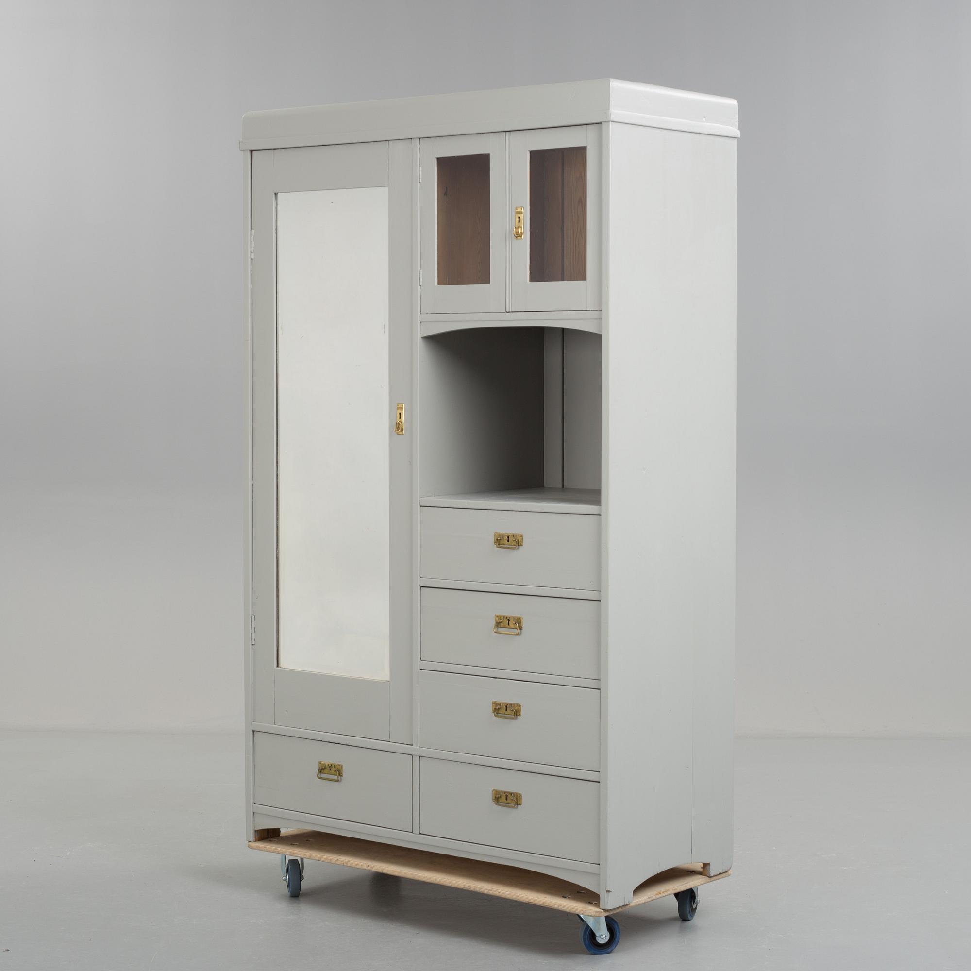 A early 20th century cabinet with mirror.
