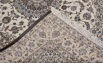 A Nain part silk carpet, 269 x 213 cm.