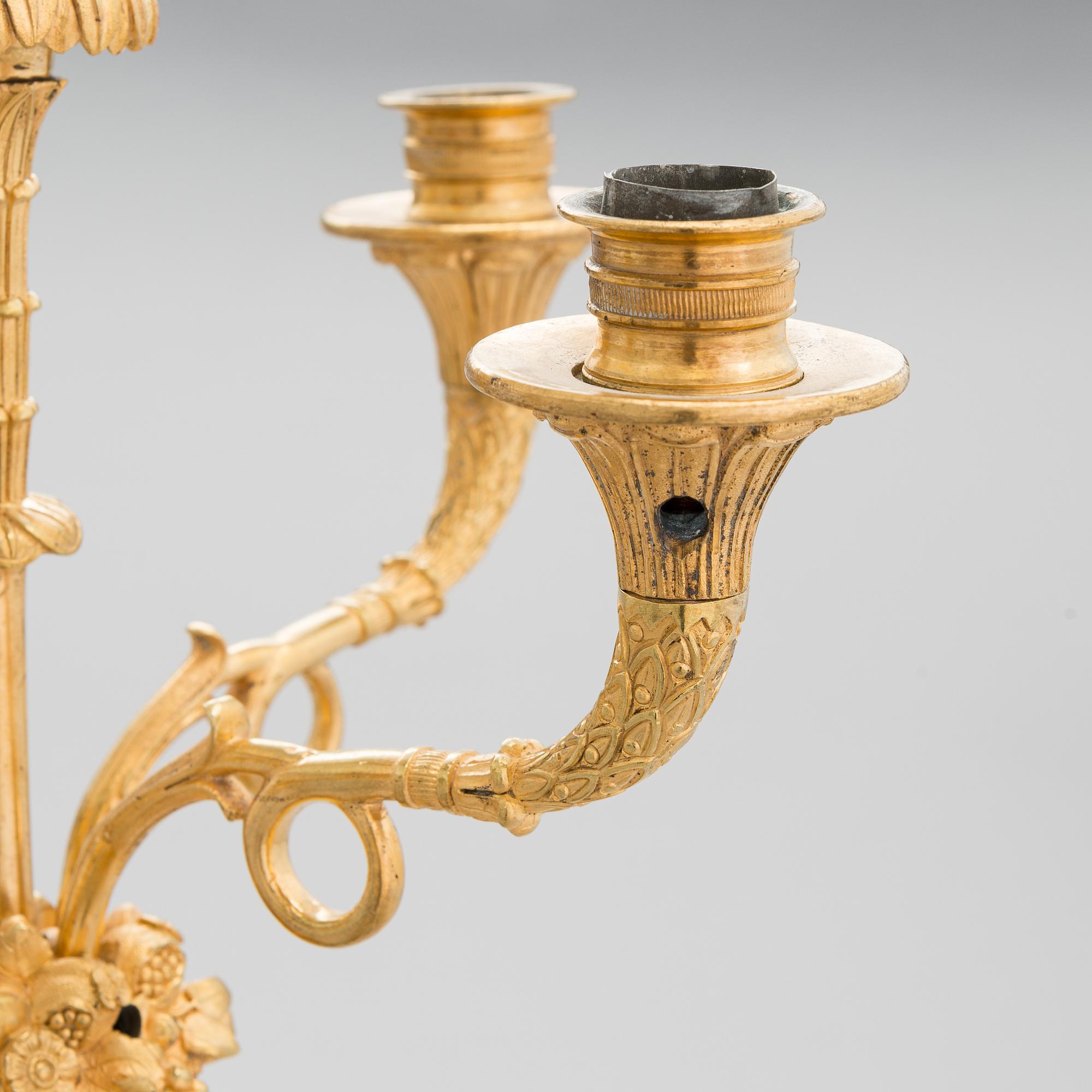 A latter half of the 19th-century candelabrum/ table light, altered in the 20th century.