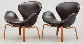 A pair of Arne Jacobsen brown artificial leather 'Swan' easy chairs, Fritz Hansen 1966.