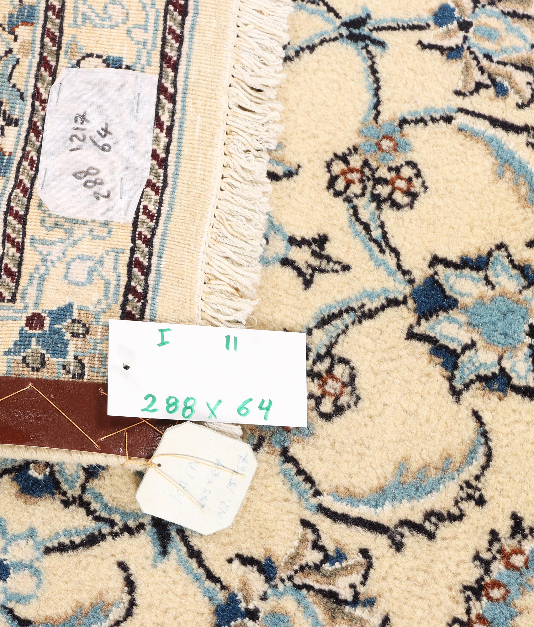 A Nain runner, part silk, c. 288 x 64 cm.