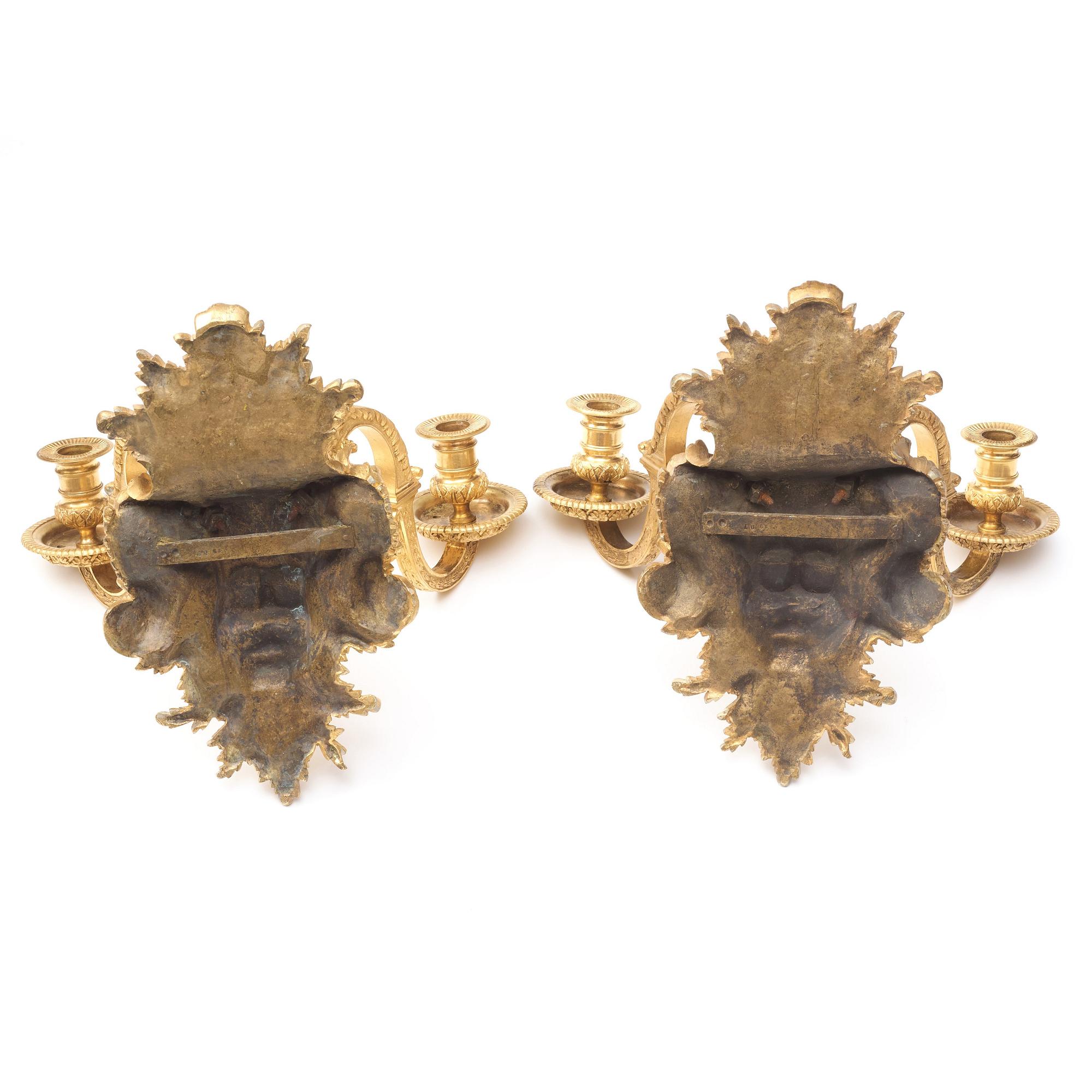 A pair of Baroque-style mid 19th century two-light wall-lights.