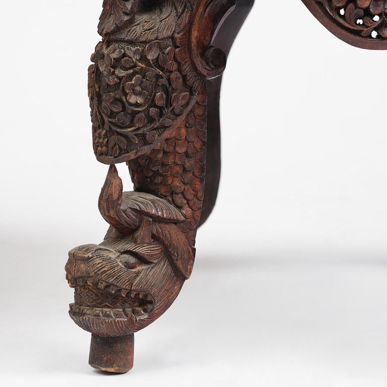 A pair of carved 'blackwood' armchairs, Bombay presidency, British Raj, circa 1880.