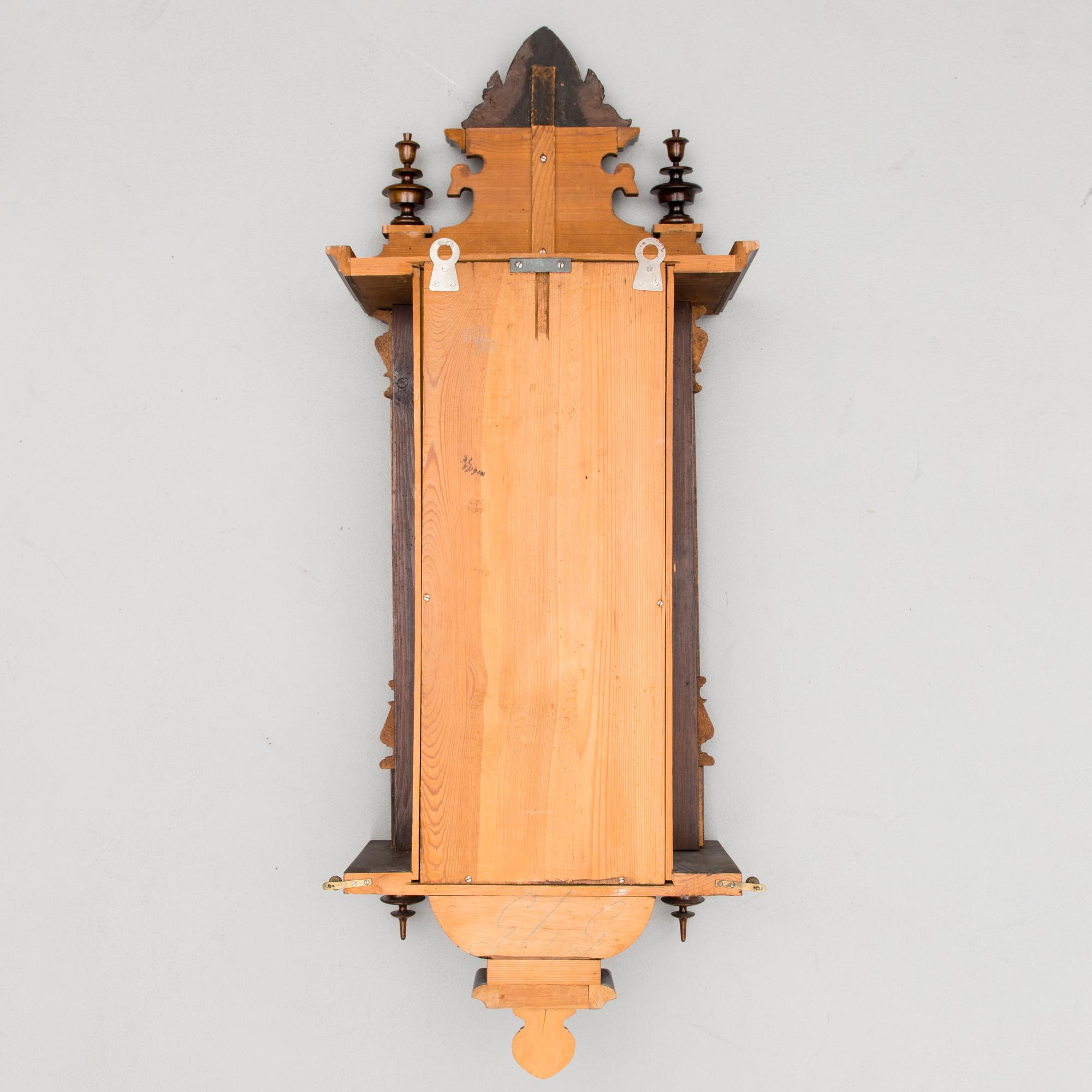 A neo renaissance German Junghans wall clock from around the turn of the 20th Century.