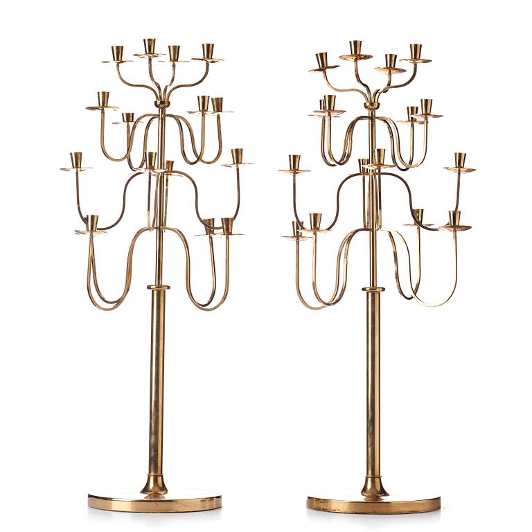 Svenskt Tenn, a pair of Swedish Modern brass candelabra, 1940-50's, probably designed by Josef  Frank.