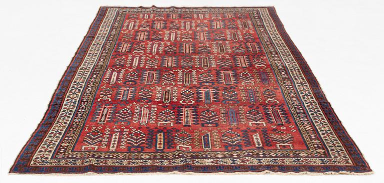 An antique carpet, probably Shirvan, c. 330 x 172 cm.