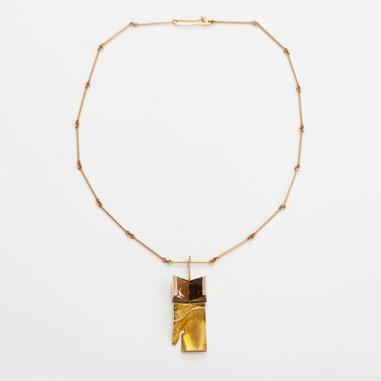 Björn Weckström, "Narcissos", a 14K gold pendant with a smoaky quartz and a rock crystal. Lapponia 1965.