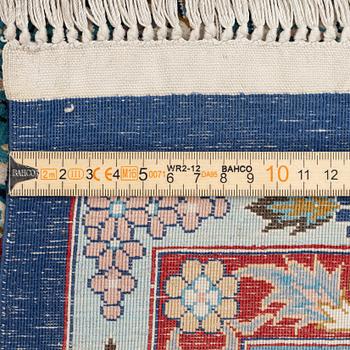 An oriental silk rug. c. 274 x 180 cm .