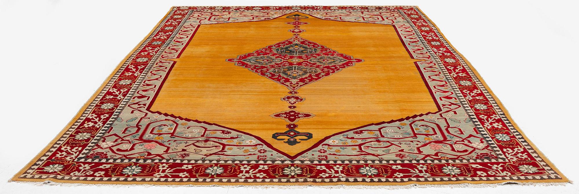 An antique Agra carpet, northern India, c. 389 x 289 cm.