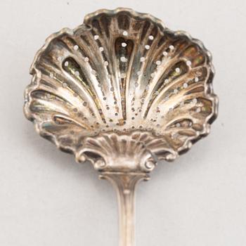 A Set of Silver Spoons and a Server, 18th-20th Century (5 pieces).