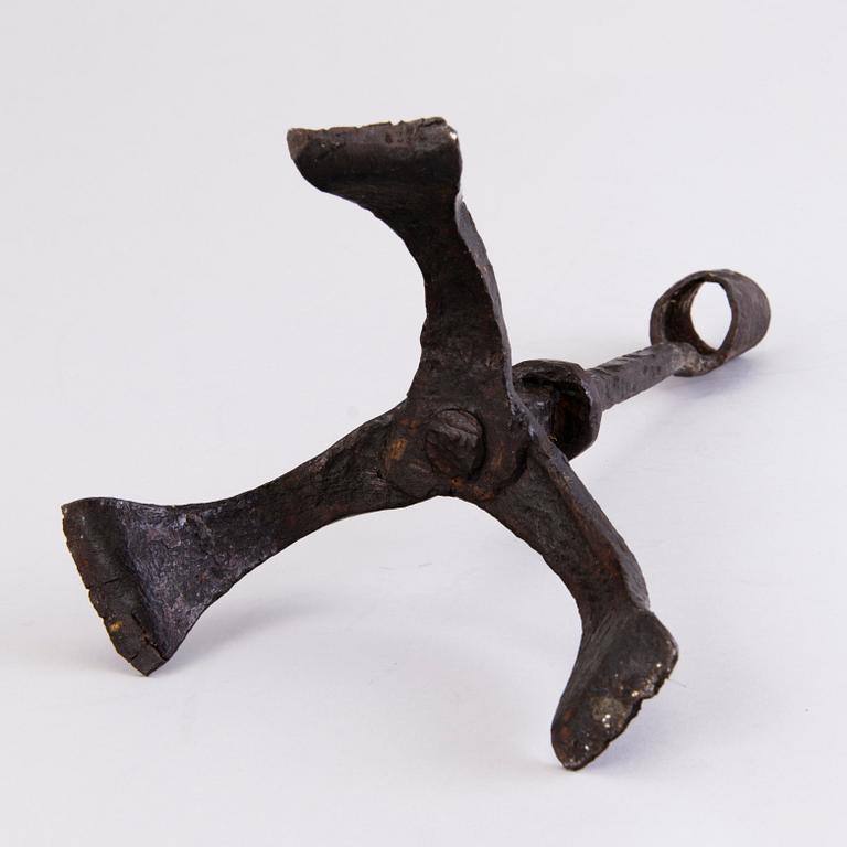 A CANDLESTICK, iron, 18th century or older.