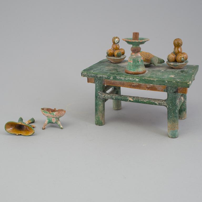A group of eight chinese figures with three objects, earthenware, Ming dynasty.