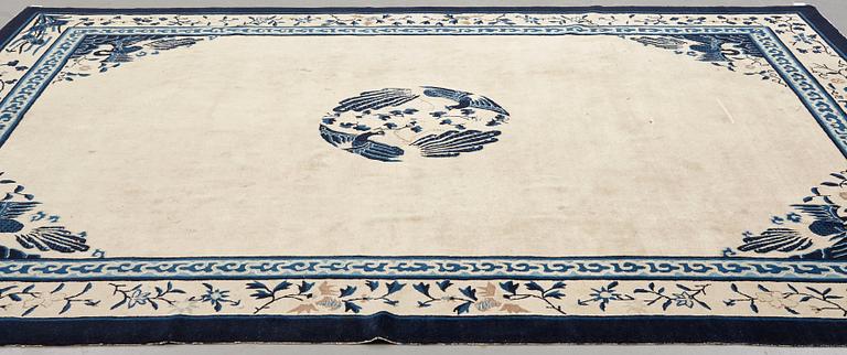 A carpet, a semi-antique China, ca 348,5-350 x 279,5-282,5 cm.