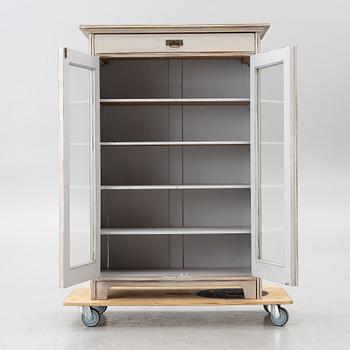 Display cabinet, early 20th century.