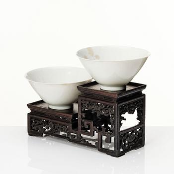 Two Chinese white glazed anhua decorated dragon bowls, Qing dynasty.