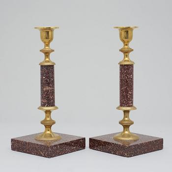 A pair of Swedish late 19th century porphyry candlesticks.