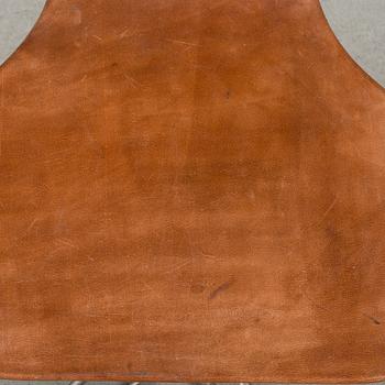 A contemporary iron easychair.