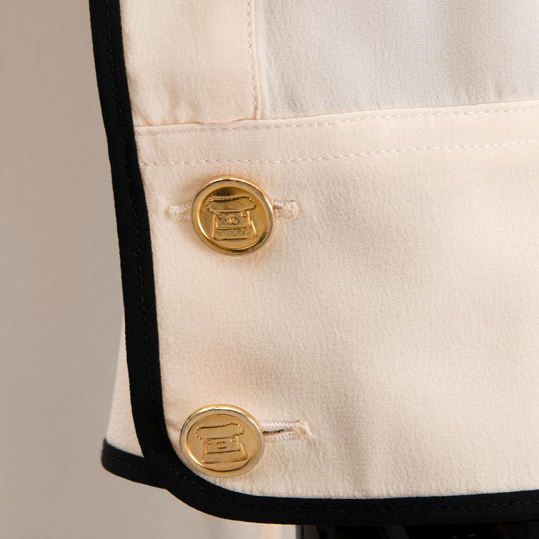 Two Chanel Crepe de Chine Cream Coloured Silk Blouses.