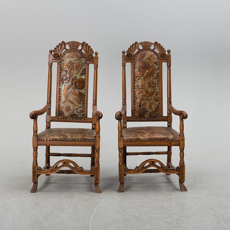 A first half of the 18th century pair of baroque oak armchairs.