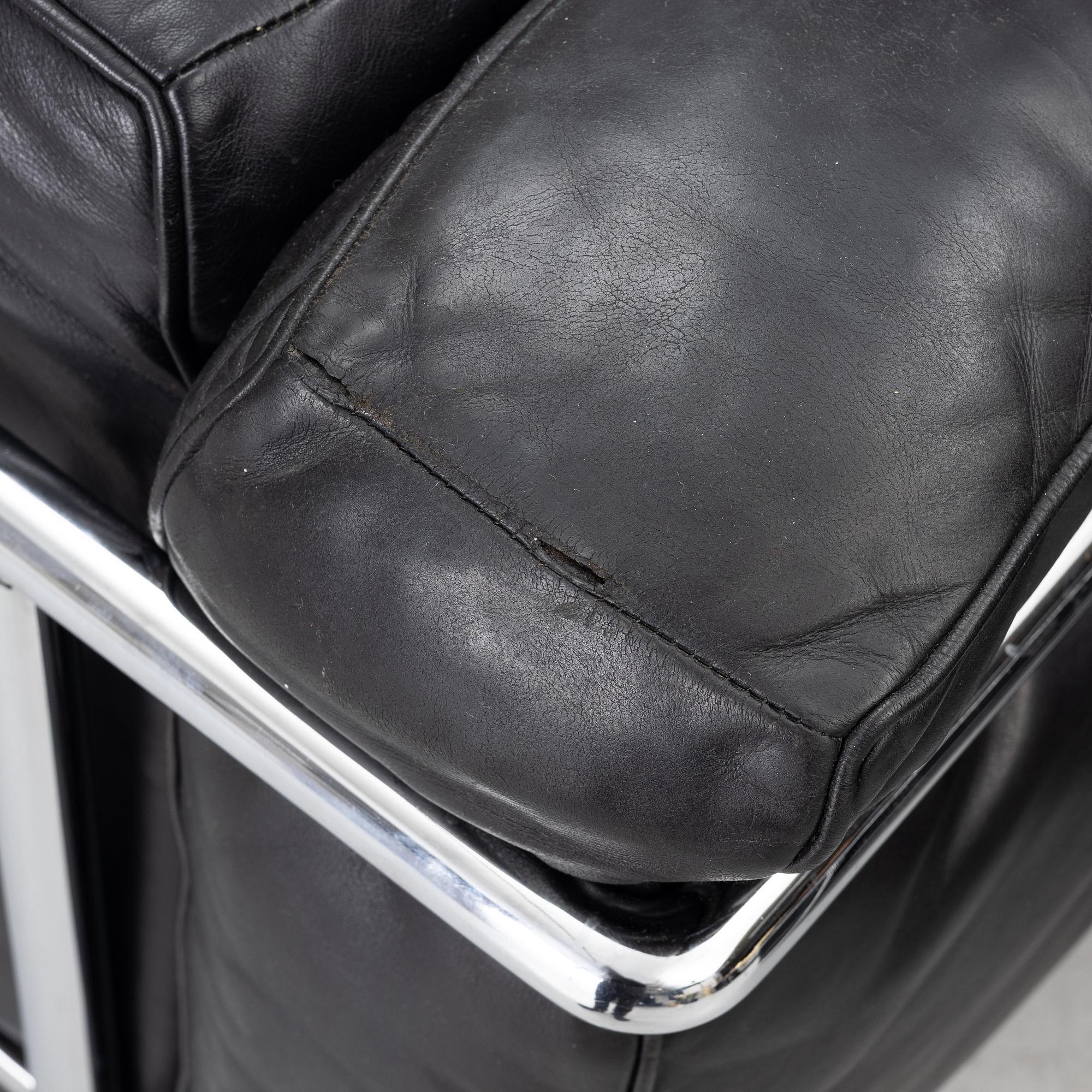 a pair of "LC2" armchairs, Cassina, second half of the 20th century.