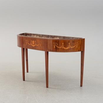 A late 19th century mahogany flower table.