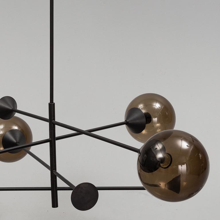 A 21st century "Kendama" LED pendant lamp, design Massimo Zazzeron, Giorgetti.
