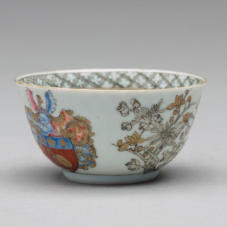 A famille rose armorial cup with saucer, Qing dynasty, 18th Century.