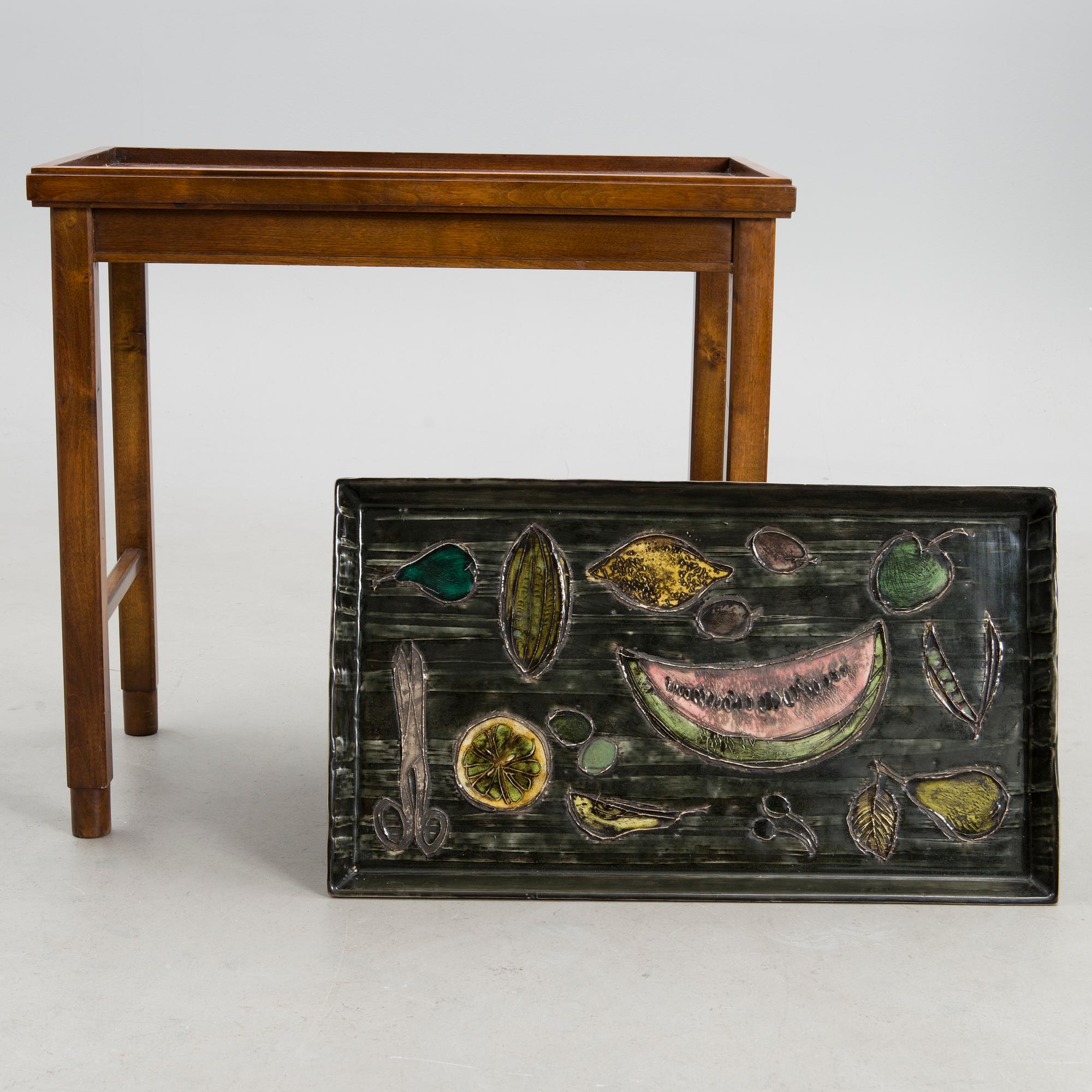 A stoneware tray table signed Bryk.