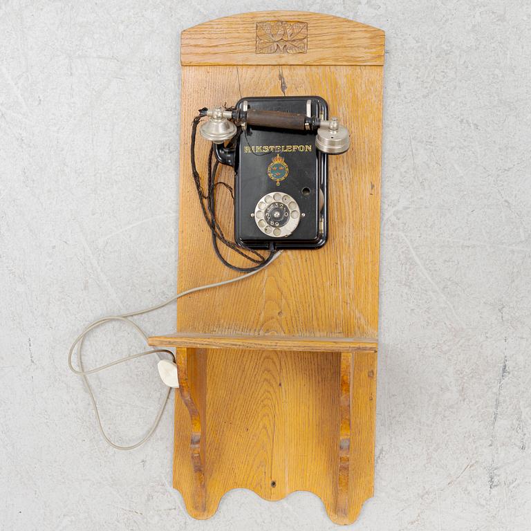 A wall mounted telphone, early 20th century.