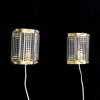 A pair of glass and brass wall lights by Wiktor Berndt for Swedish Crystal, 1970's.