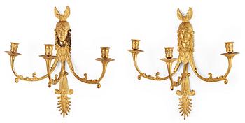 1265. A pair of Russian Empire early 19th century gilt bronze three-light wall-lights.