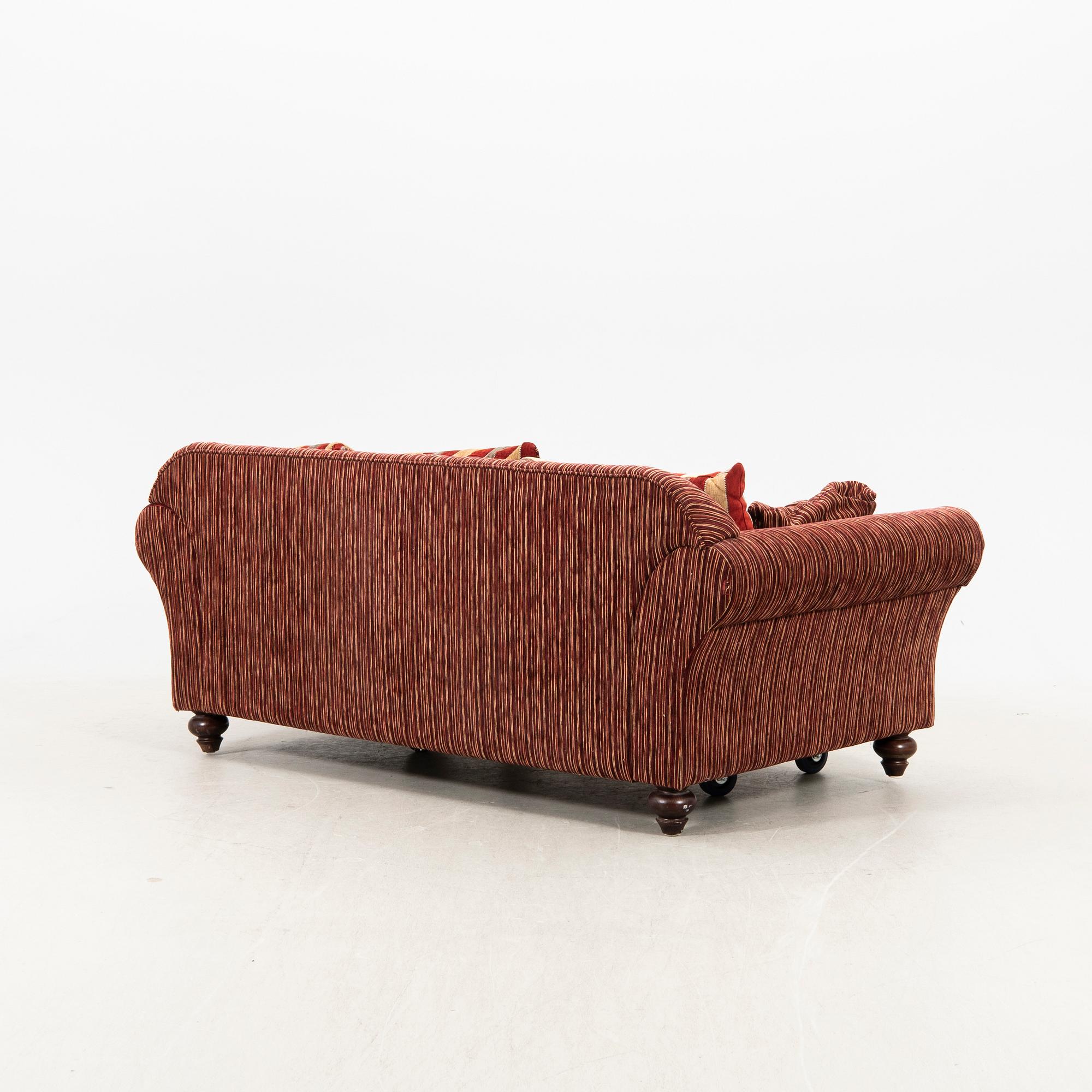 A sofa,with pillows. later part of the 20th Century.