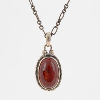 A Georg Jensen silver and cabochon-cut amber necklace.