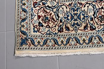 A Nain rug, part silk, 300 x 200 cm.