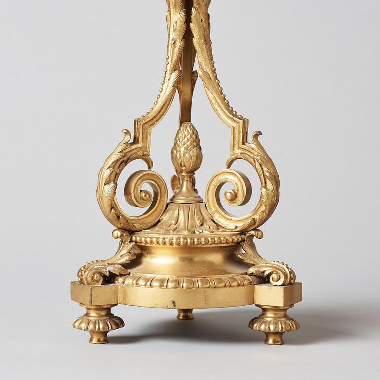 A pair of Louis XVI-style circa 1900 seven-light candelabra.