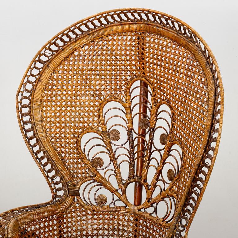 A RATTAN ARMCHAIR.