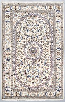 A carpet, Nain, part silk, ca 296 x 192 cm.