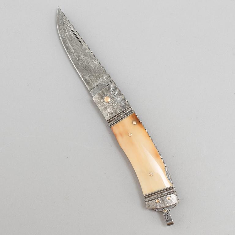Kaj Embretsen, a damascus steel folding knife, signed.