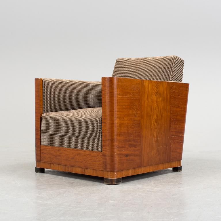 An Art Deco armchair veneered with walnut from the 1930's.