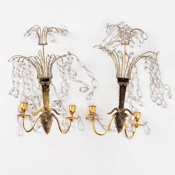 A pair of late Gustavian ormolu two-branch lustres, circa 1800.