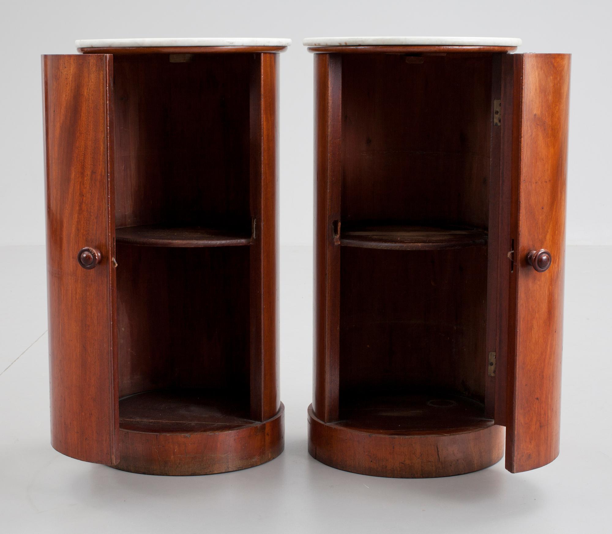 A pair of Empire 19th cent mahogany cupboards.