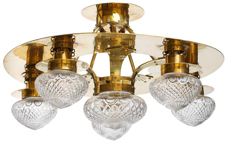 An Art Noveau brass and cut glass chandelier.